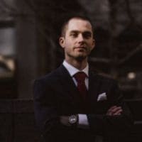 Portrait of a man wearing a dark suit